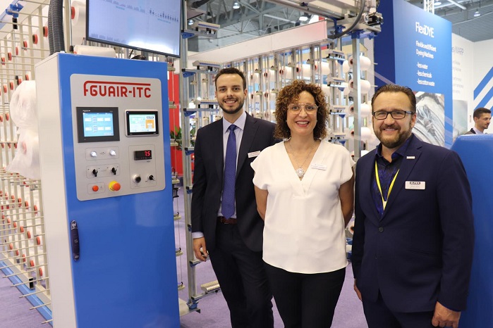 Ferran and Isabel MatarÃ³, of Comsat, with Brian Hicks, of Eltex, at ITMA 2019 in Barcelona. © Eltex