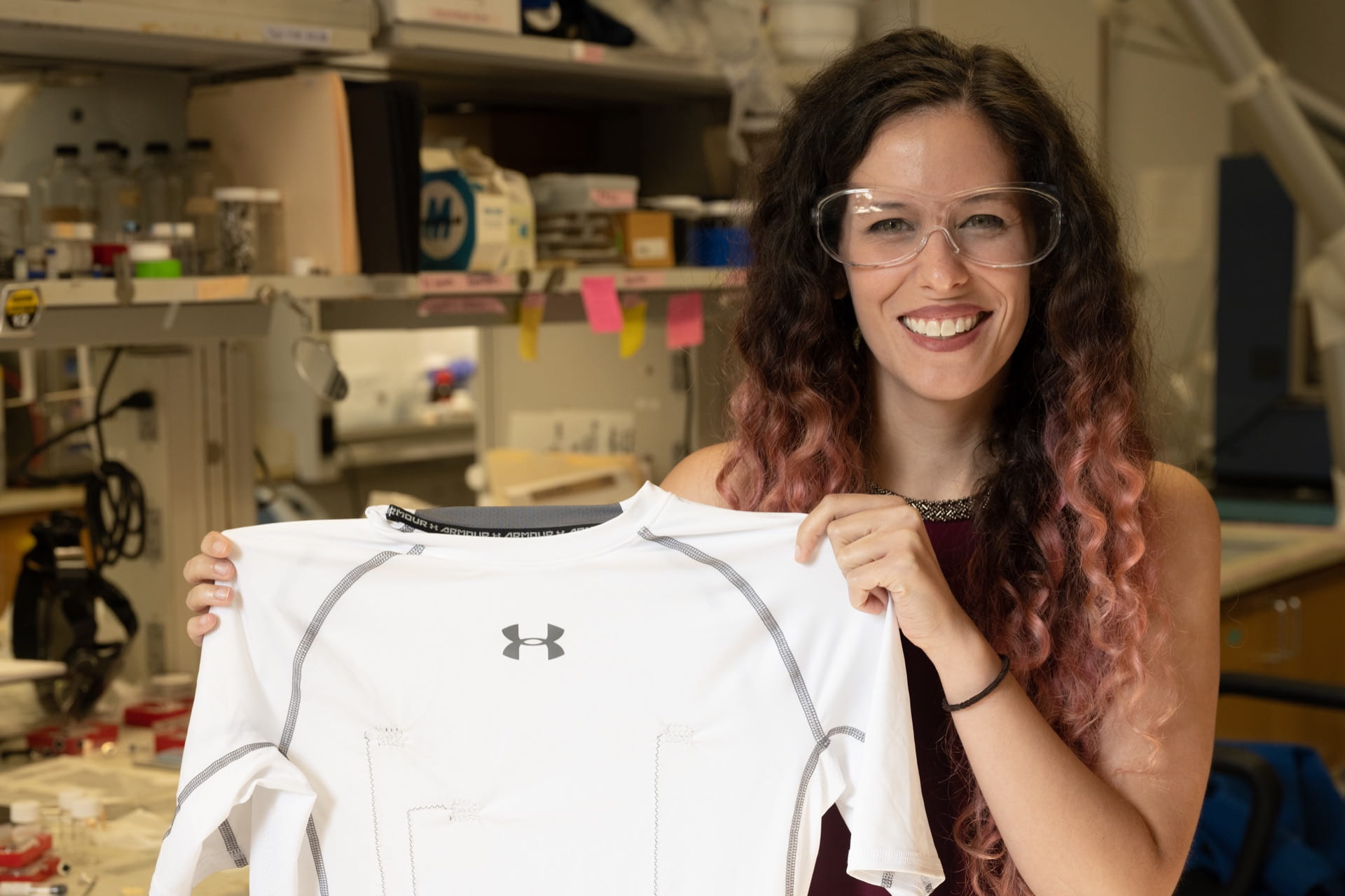 Rice University graduate student Lauren Taylor shows a shirt with carbon nanotube threads that provide constant monitoring of the wearer’s heart. © Jeff Fitlow, Rice University