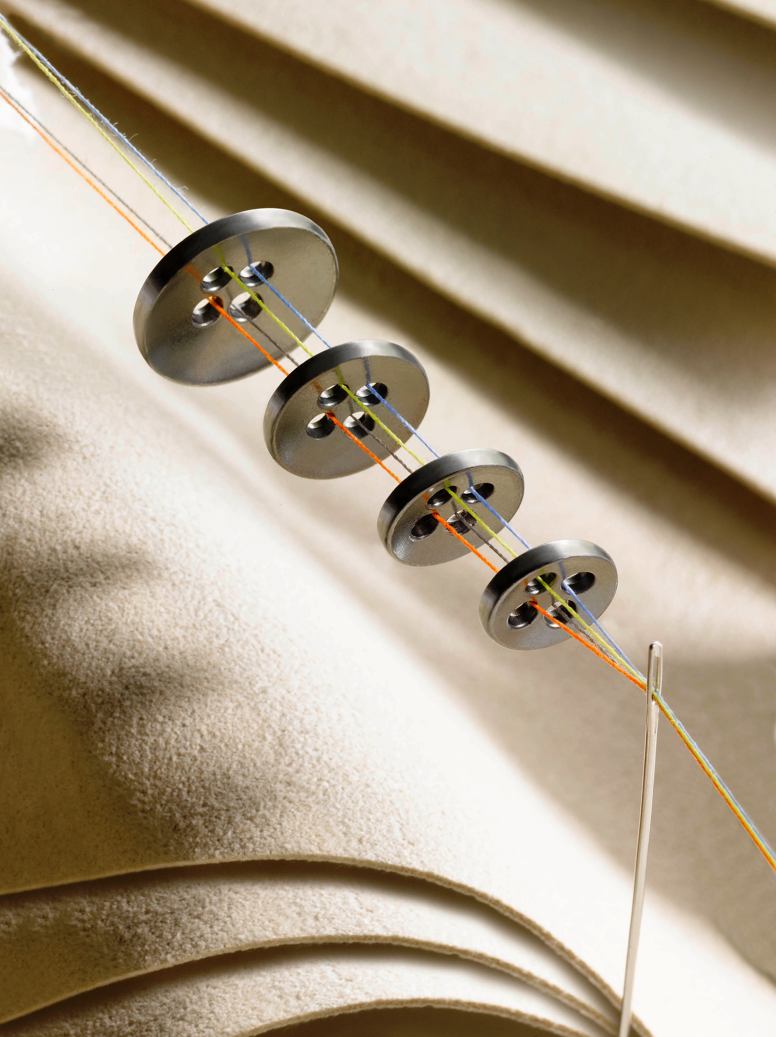 YKK has also developed a range of metal sew-on buttons available in four sizes. © YKK 