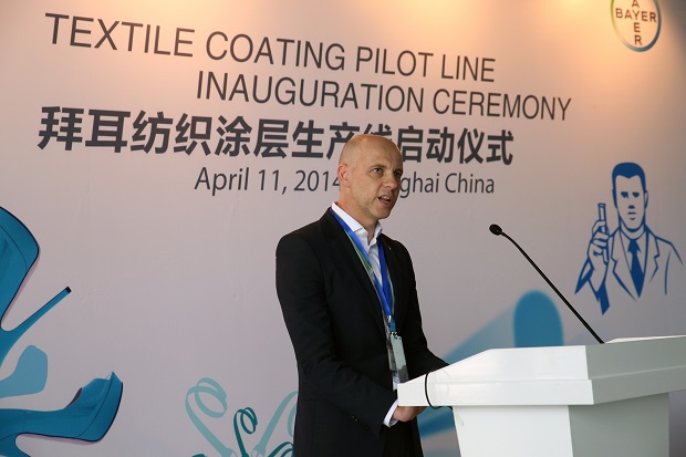 Nicholas Smith, Global Head of Textile Coating at Bayer MaterialScience, welcomes the guests at the inauguration of the new pilot line in Shanghai.  Bayer MaterialScience AG