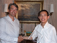 Anderson Lee of Hong Kong Nonwovens receives the Advansa ThermoCool Innovation Award from David Bayliss of Advansa.