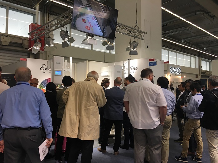 Visitors crowd the Coloreel booth at Texprocess. © Innovation in Textiles