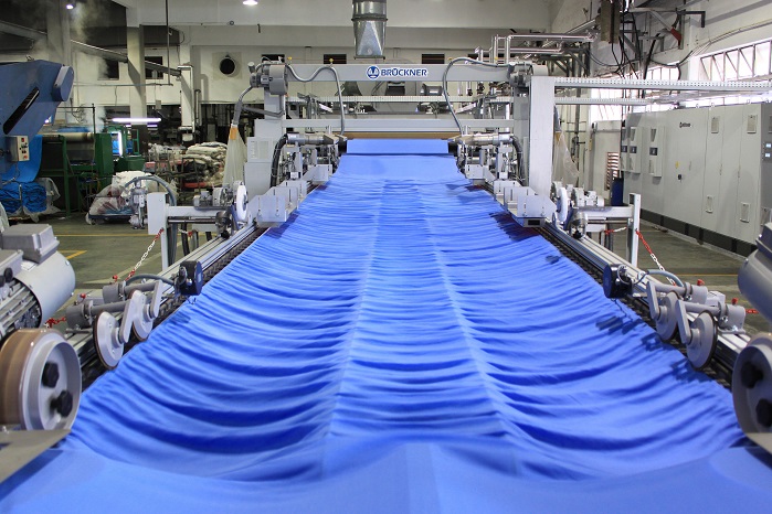 View of the stentering zone in front of the relaxation dryer. © Brückner Textile Machinery/ Tropic Knits Group