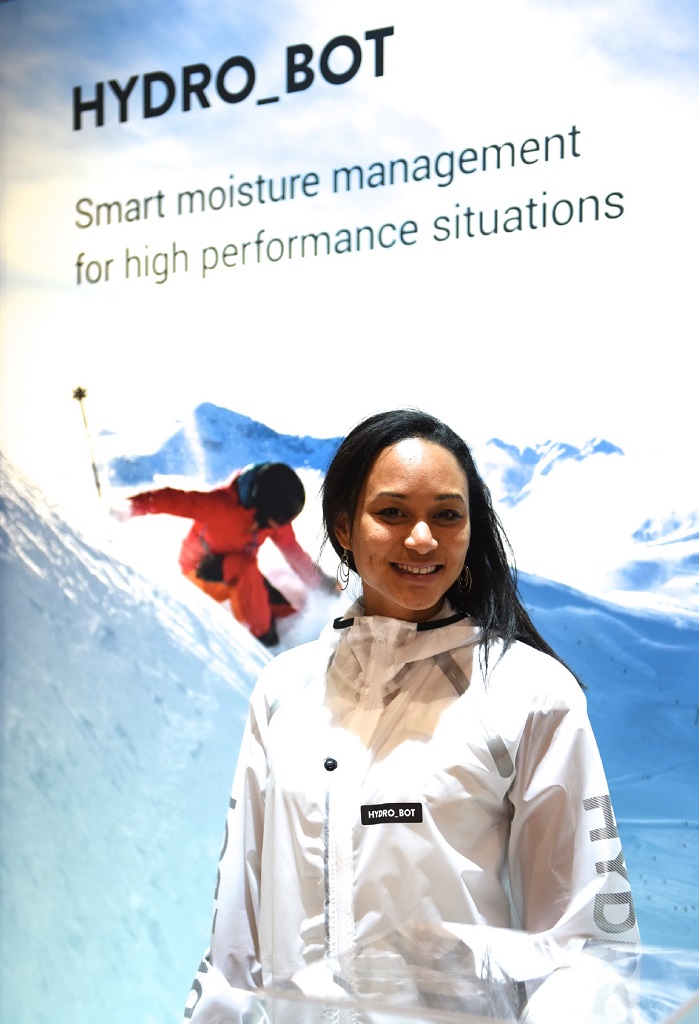 Senior scientist Stephanie Say-Liang-Fat from Osmotex with the Hydro_Bot prototype jacket being showcased at ISPO in Munich this week. © Osmotex