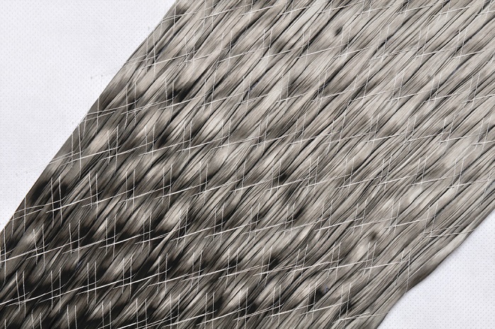 In many hand lay-up processes that use carbon fibre woven material, waste materials can easily account for 50% or more of the total weight of carbon used. © ZSK USA 
