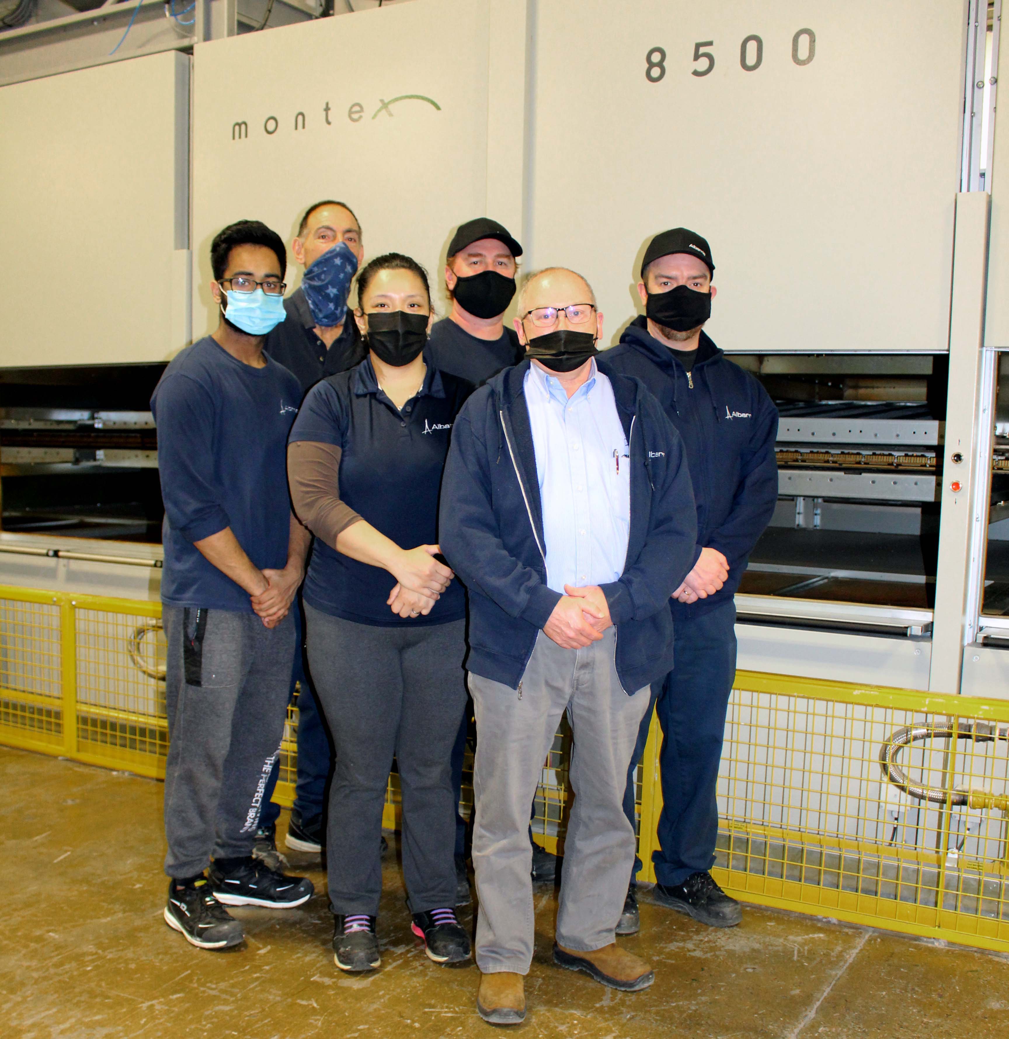 The Albarrie team at the new machine in the company’s plant in Barrie, Ontario. © Albarrie