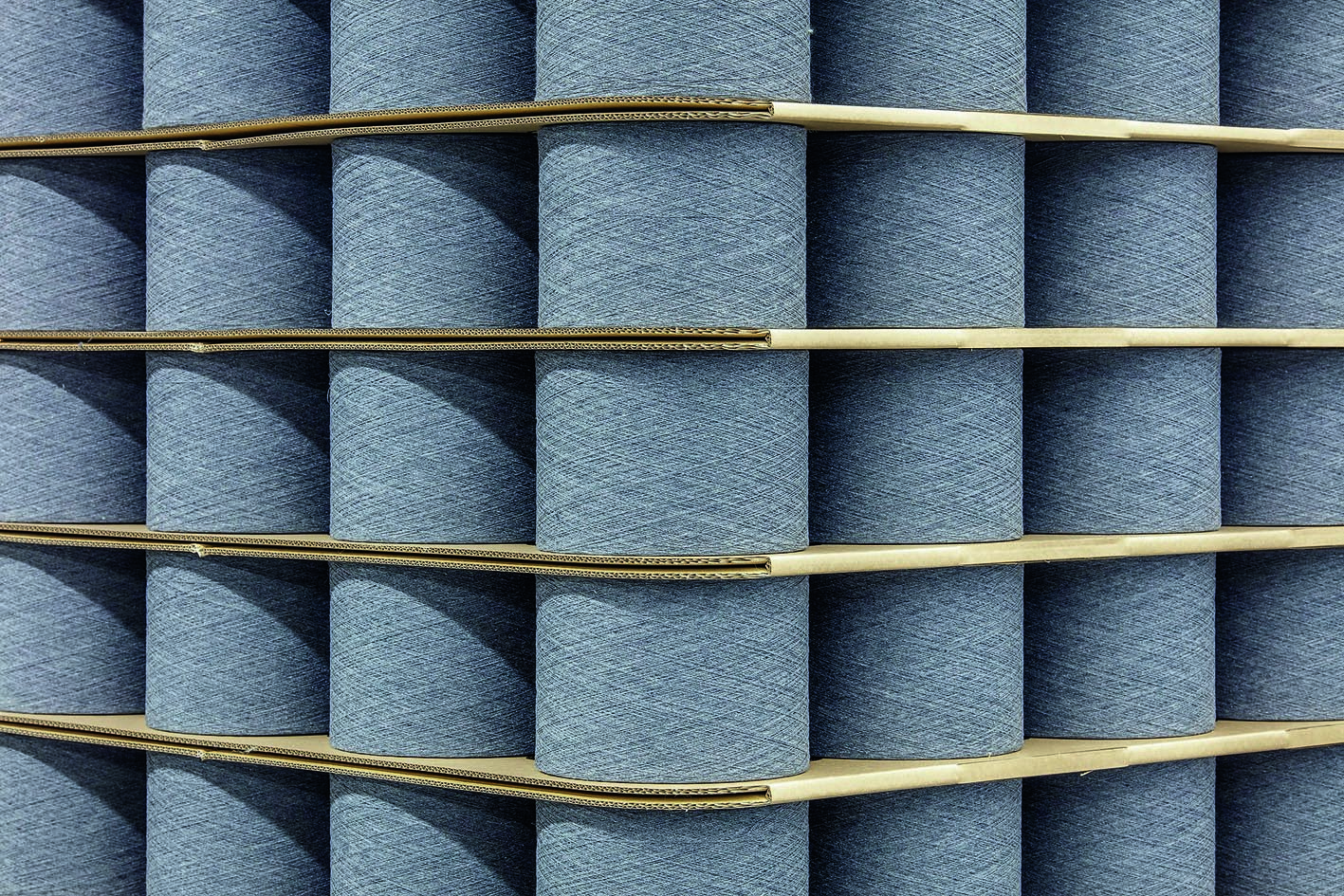 Yarn cones from recycled fibres. © Trützschler