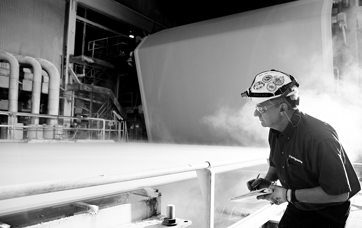 In the press section of a paper machine, more water is mechanically removed from the newly formed sheet. © AstenJohnson