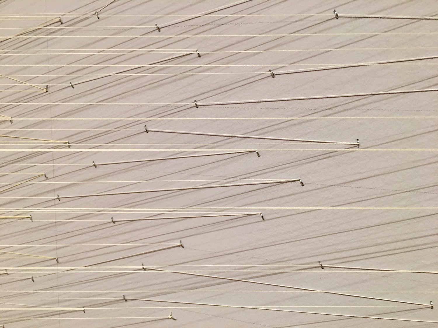 Detail of the installation showing each of the threads attached to the lavender walls. © Marie O’Mahony