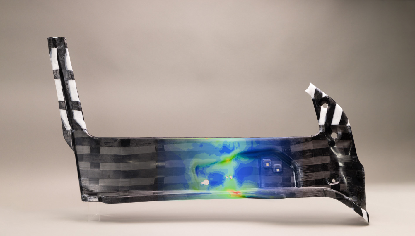 The door component is based on glass and carbon-fibre reinforced polypropylene UD tapes laminated to a Braskem extruded polypropylene sheet. © WEAV3D