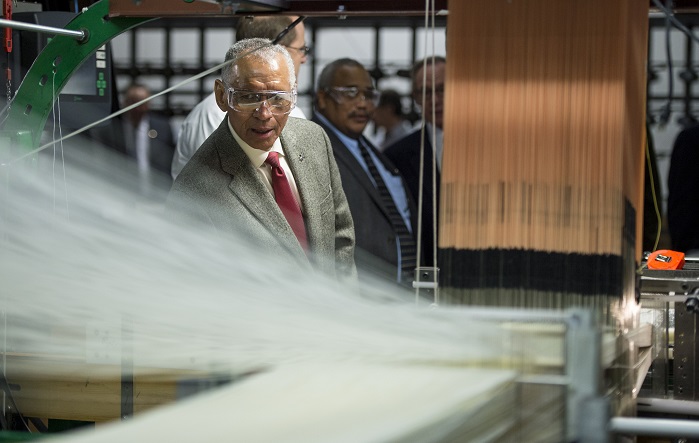 NASA Administrator Charles Bolden inspects a loom at Bally Ribbon Mills (BRM) facility. © NASA