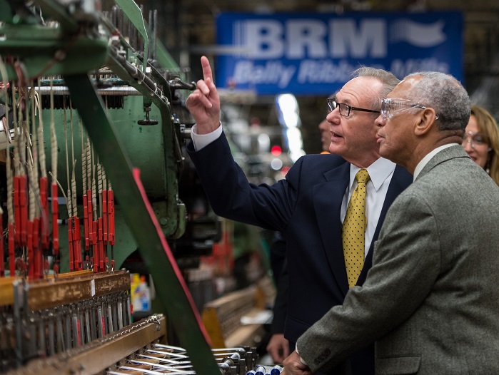NASA Administrator Charles Bolden, right, is given a tour of Bally Ribbon Mills (BRM) manufacturing facility by BRM President Ray Harries on Friday, 9 January. © NASA