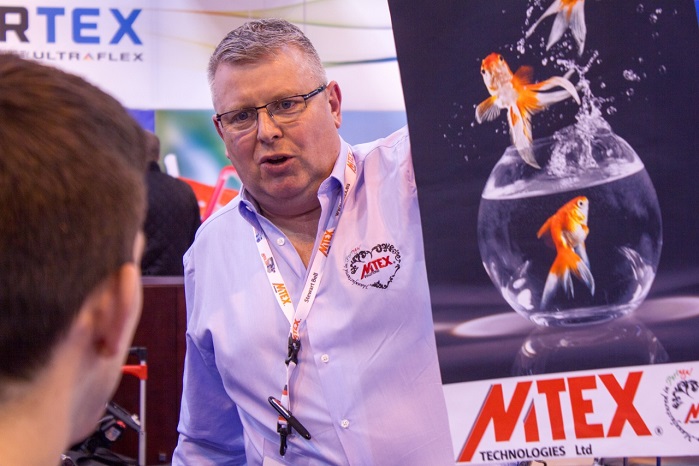 MTEX Technologies MD Stewart Bell shows the density of the black in a backlit image at Sign & Digital UK. © MTEX Technologies 