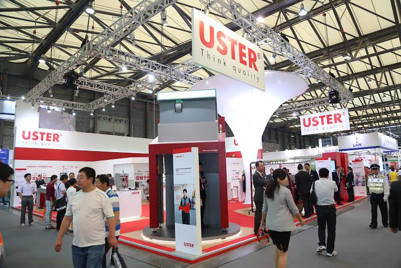 The company’s booth at ShanghaiTex was easily recognized by its distinctive tall funnel, guiding visitors to a red-carpeted world of quality testing and monitoring. © Uster Technologies 