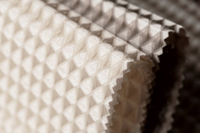 3D acoustic fabric Tasso from flame retardant Trevira hybrid yarns with stiffening effect. © Hohmann