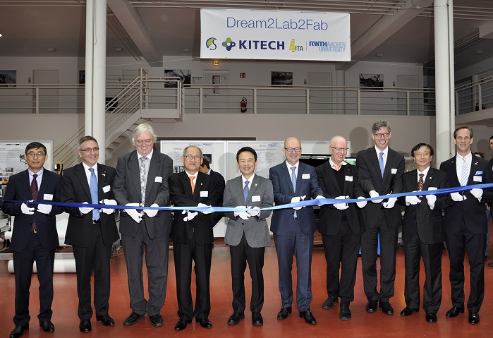 Tape-cutting ceremony (from left to right): Mr Chang Rok Keum, Consul General of the Embassy of South-Korea; Prof Dr Thomas Gries, Head of ITA, Germany; Prof Dr Aloys Krieg, Prorector RWTH Aachen University, Germany; Mr Kyu Sang Chung, PhD, President of the Sungkyunkwan University (SKKU), South-Korea; Mr Kyung-pil Nam, Governor of the Gyeonggi Province from South Korea; Dr Thomas Grünewald, State Secretary of the Ministry for Innovation, Higher Education and Research of North Rhine-Westphalia, Germany; Prof Dr Matthias Jarke, Head of Fraunhofer Institute for Applied Information Technology FIT, Germany; Mr Marcel Philipp, Lord Mayor of the city of Aachen, Germany; Mr Youngsoo Lee, PhD, President of the Korea Institute of Industrial Technology (KITECH), South-Korea; Mr Adjunct-Prof (Clemson-Univ.) Dr Yves-Simon Gloy, Head of Department Textile Machine Engineering of ITA, Germany. © ITA