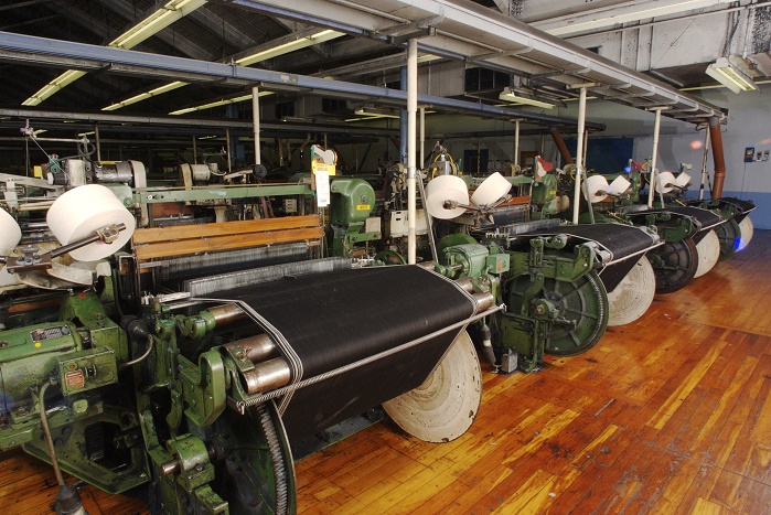 The fabric is produced on American Draper X3 Shuttle looms. © Cone Denim