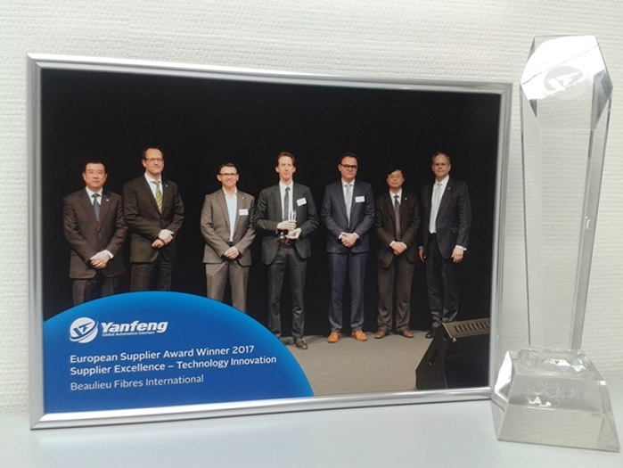 Donald De Deygere and Jefrem Jennard receiving the Yanfeng Automotive Interiors Supplier Excellence award. © Beaulieu Fibres International