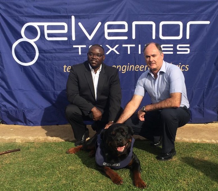 DuPont Segment Leader for Kevlar Life Protection Sub-Saharan Africa, Allen Chimhandamba, K9 Oscar and Dicky Coetzee (Gelvenor Chief Executive). © Gelvenor