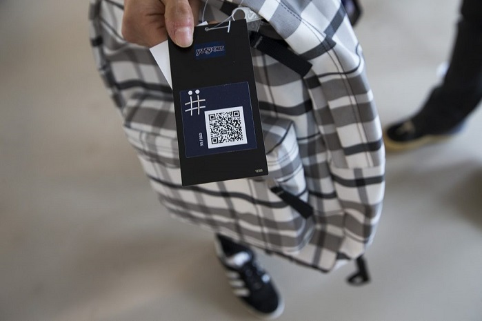 The JanSport backpack is capable of storing information in its fabric that can then be accessed using an app on a smartphone. The QR code allows the backpack owner to connect the bag to the AFFOA Looks app. Other people with the app can then scan the backpack itself and see what the backpack owner has uploaded. © Jesse Costa/WBUR