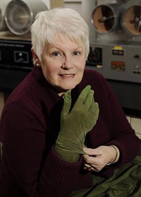 Cheryl Farr, ISU's new Noma Scott Lloyd Chair in Textiles and Clothing, displays one of the RYNOSKINâ„¢ gloves that she helped to test. Photo by Bob Elbert, ISU News Service