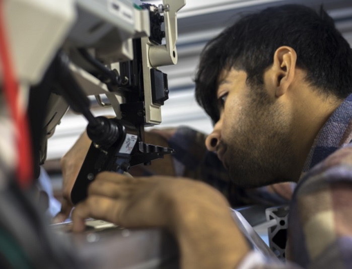 Engineer realigning vision components. © SoftWear Automation, all rights reserved Engineer realigning vision components. © SoftWear Automation, all rights reserved