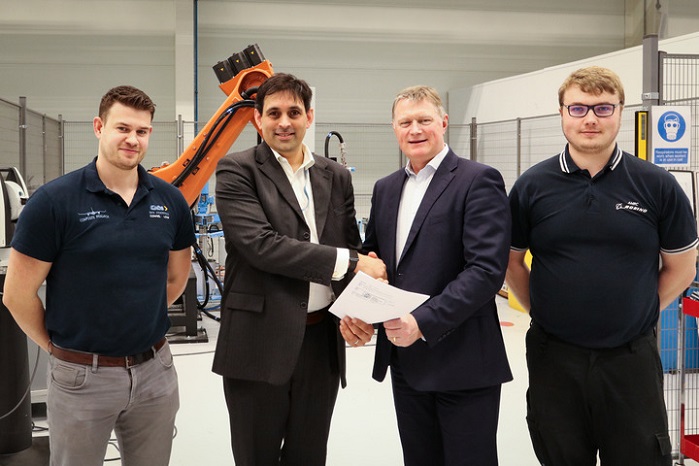 Paul Perera of GKN and Colin Sirett of the AMRC sign the agreement. Also in the pictures is Joe Coltham of GKN and the AMRC’s Ben Fisher. © AMRC