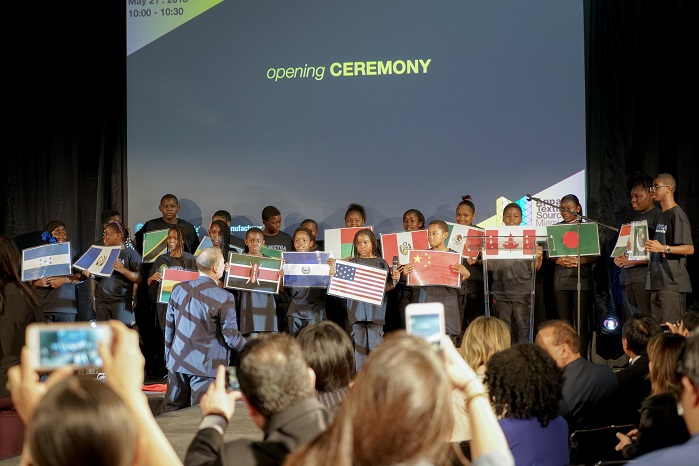 Flag Ceremony with kids from Meyga Learning Center welcoming seven countries. © Apparel Textile Sourcing Miami