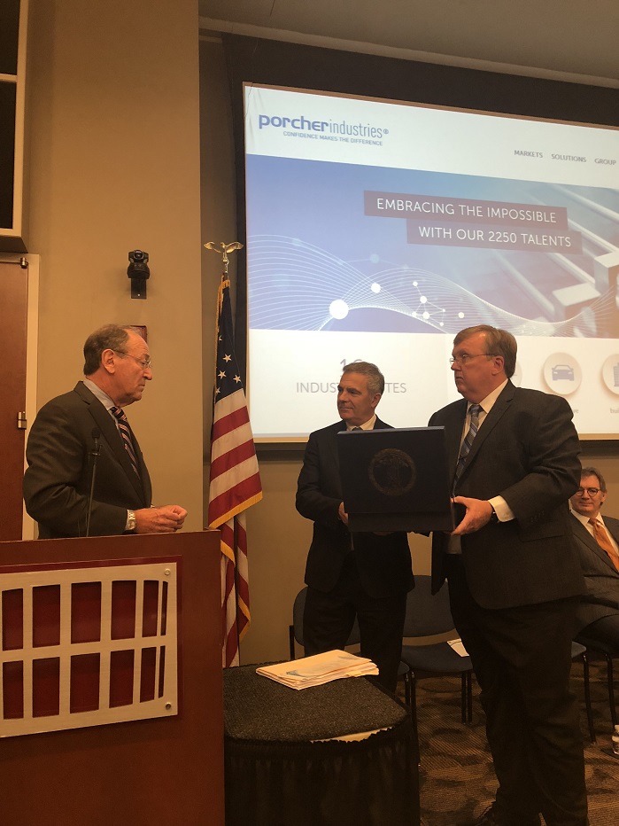 Virginia Secretary of Commerce Brian Ball (left) presents Porcher Industries Group President and CEO AndrÃ© Genton (middle) and BGF Industries’ Jerry Barbour (right) with a Virginia Commonwealth Flag to be displayed at BGF’s new corporate headquarters in Danville. © Porcher Industries